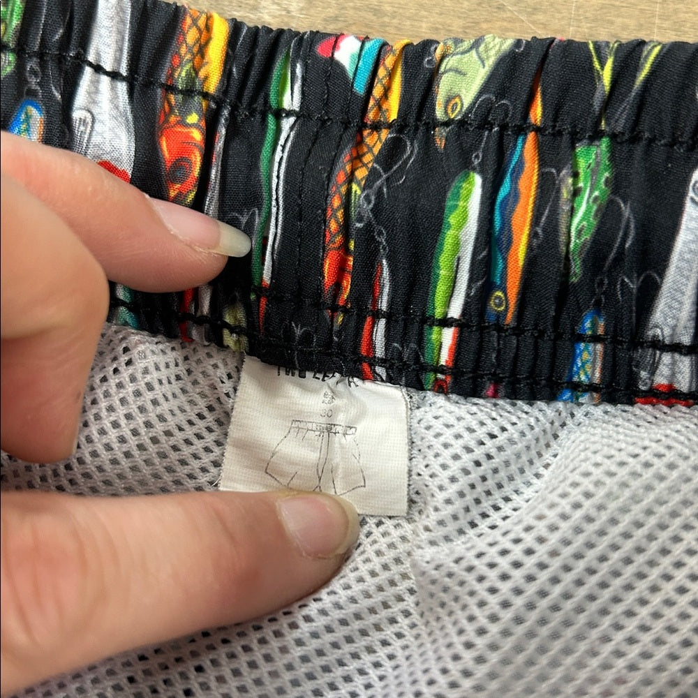 Two Left Feet Lure Me Away Swim Trunks
Size Small